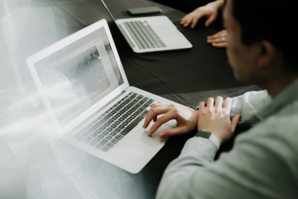 Professional using AI and laptop technology